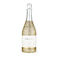 a bottle of champagne with gold glitter on a black background